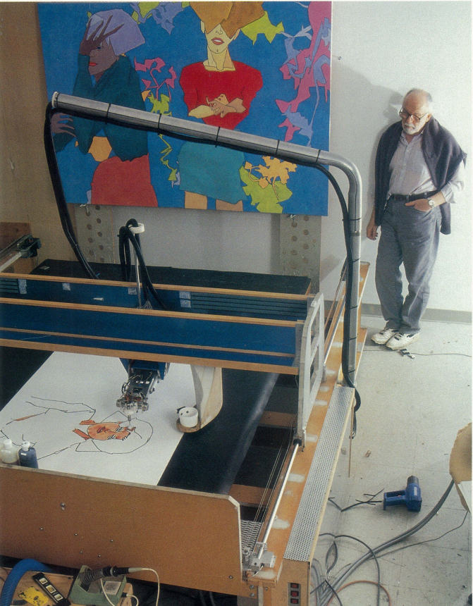 Коэн наблюдает за роботой подопечного.